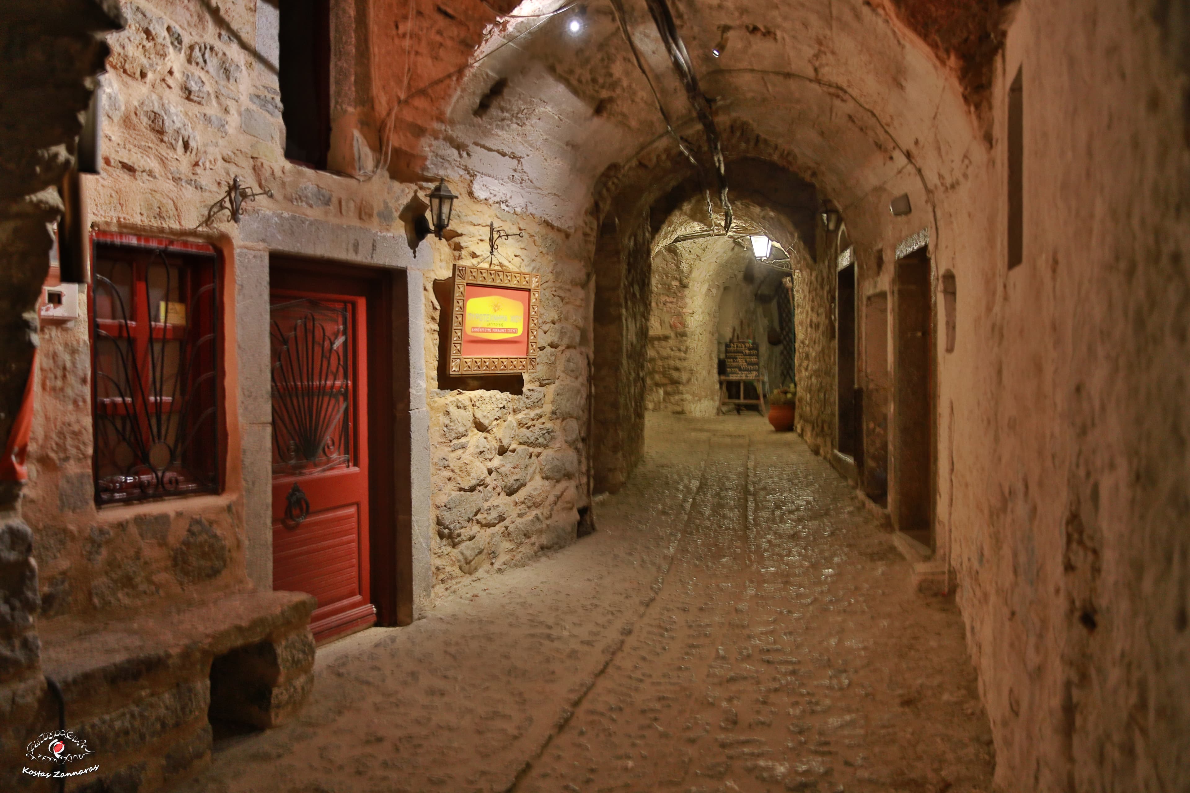 Explore the charming traditional buildings on a sunny day in Chios, Greece.